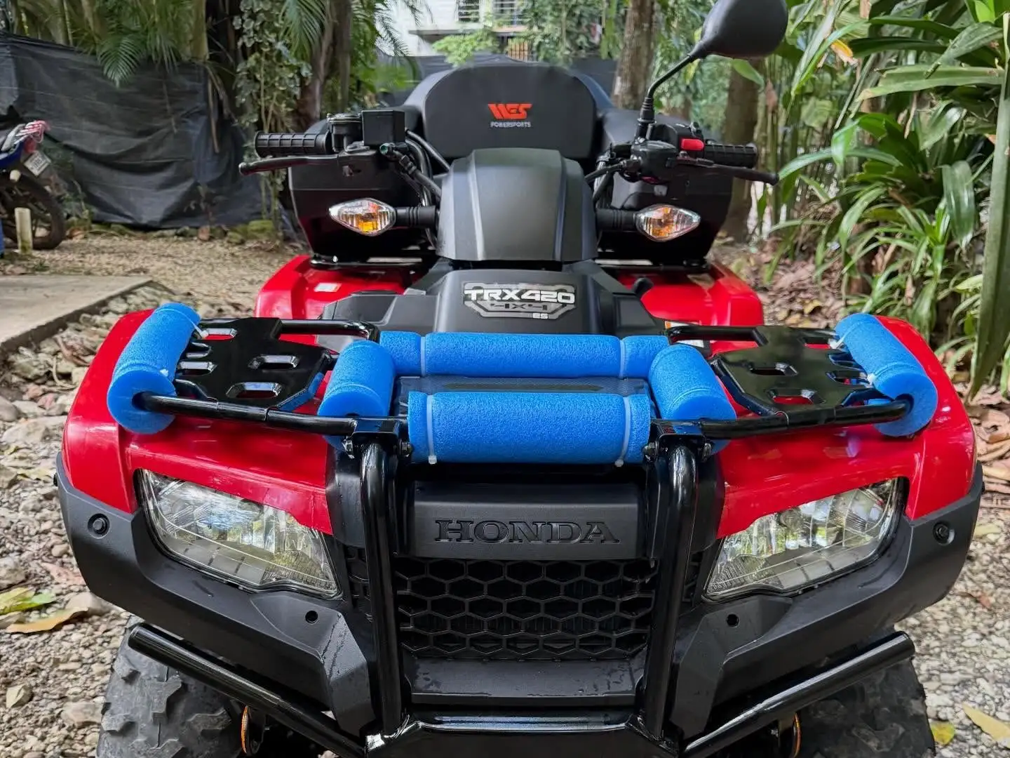 Red Honda TRX420 ATV included in the surf and ATV combo